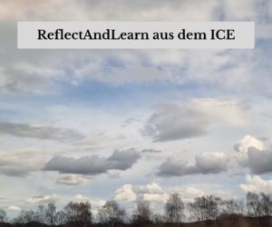 Eine Wolkenlandschaft, aus dem ICE fotografiert, mit der Aufschrift: ReflectAndLearn aus dem ICE